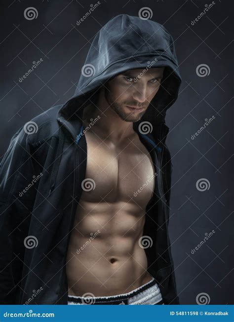 Handsome Athlete Withh Naked Torso Doing Squats With In The Sport Center Stock Photo