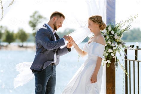 wedding ceremony on a high pier near the river 21543075 Stock Photo at ...