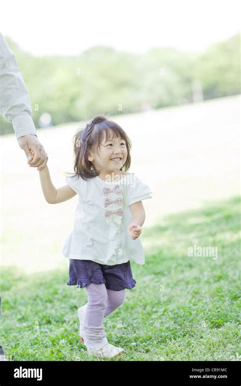 A family holding hands Stock Photo - Alamy