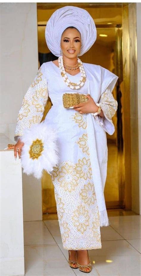 Exquisite White And Gold Aso Oke Nigerian Traditional Couples Outfit