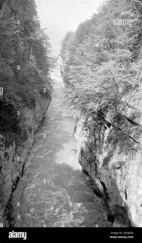 The picture shows a view of the River Salzach as it flows through a ...