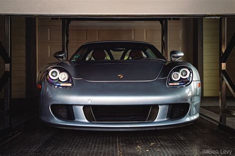 Silver Porsche Carrera Gt In Garage Benlevy