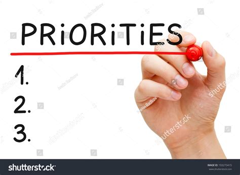 Hand Writing Priorities List Marker Isolated Stock Photo