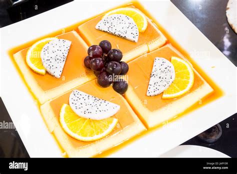 pudding custard with tropical fruit Stock Photo - Alamy