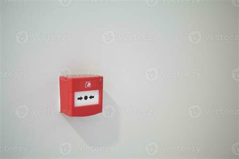 Red fire alarm button on wall , 34003894 Stock Photo at Vecteezy