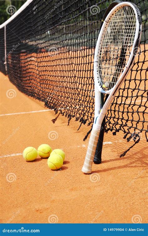 Tennis Rackets With Ball On Green Grass Background Stock Photography