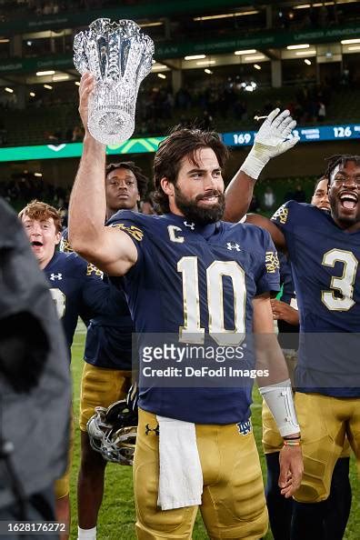 Sam Hartman Of Notre Dame Lifts The Trophy For The Mvp After The Aer