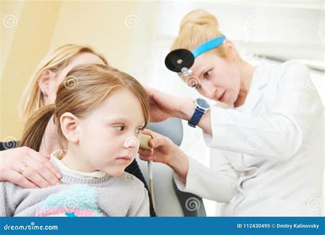 Ear Nose Throat Examining Ent Doctor With A Child And Endoscope