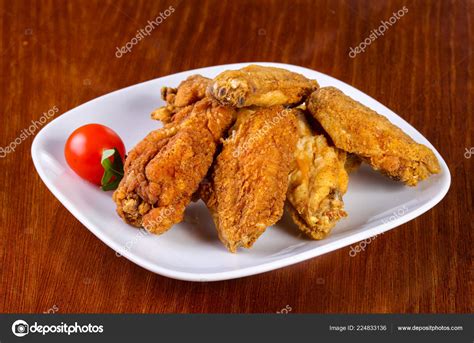 Chicken Wings Heap Served Cherry Tomato Stock Photo Andreyst