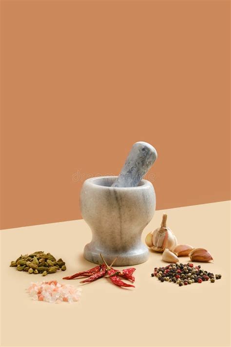 Natural Stone Mortar And Pestle Surrounded With Spice Stock Photo