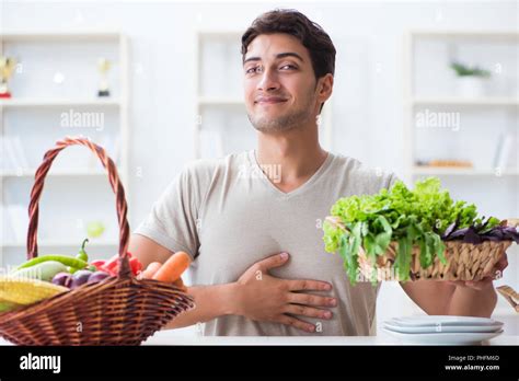 Young Man In Healthy Eating And Dieting Concept Stock Photo Alamy