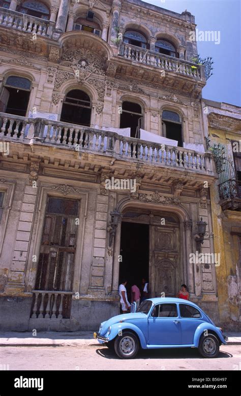 A Vintage Vw Beetle Car Outside A Colonial Building In Old Havana Cuba