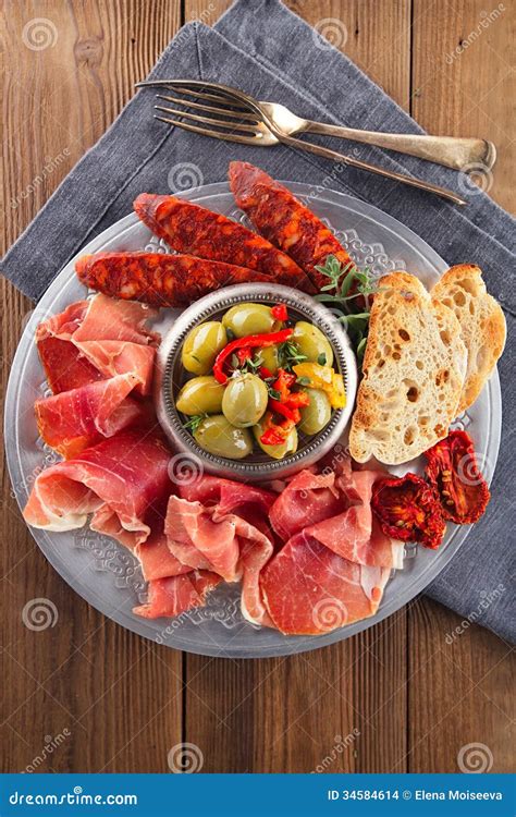 Platter Of Serrano Jamon Cured Meat Ciabatta Chorizo And Olive Stock