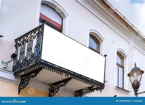 White Commercial Blank Banner Hanging On Balcony Of Office Building