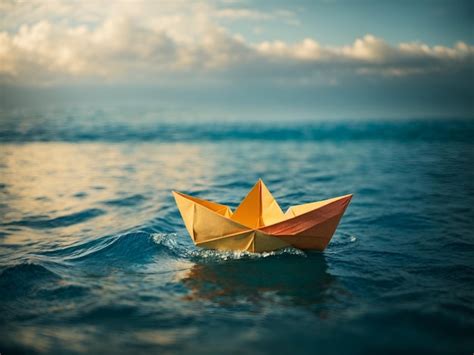 Premium Photo A Small Paper Boat Floating On An Ocean