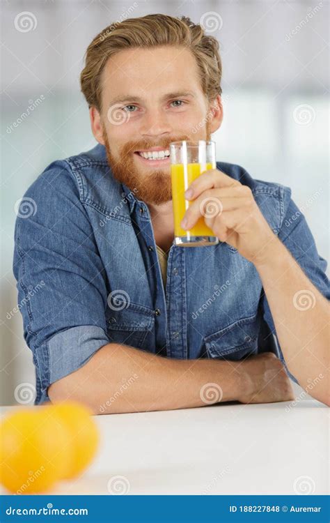 Smiling Young Man Drinking Orange Juice Stock Photo Image Of Cafes