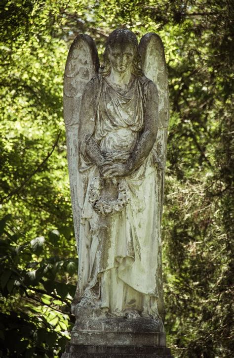 Sculpture of a Grieving Angel Stock Photo - Image of statue, stone ...