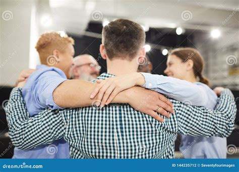 Group Hug In Therapy Session Stock Photo Image Of People Embracing