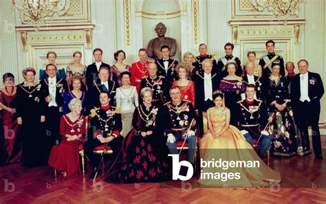 Image of Denmark's Queen Margrethe II poses with her family as she