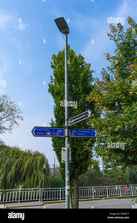 Street light with direction signs Stock Photo - Alamy