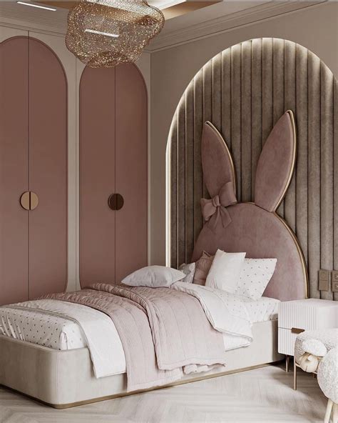 A Bed Room With A Neatly Made Bed Next To A Large Bunny Head On The Wall