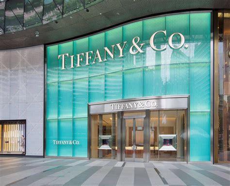 The two-story façade is lit with Tiffany Blue and carved with a ...