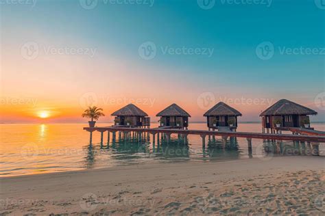 Maldives island sunset. Water bungalows resort at islands beach. Indian ...