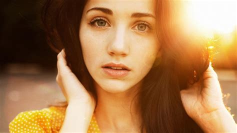 1366x768 Emily Rudd Women Face Blue Eyes Looking At Viewer Hands In Hair Sensual Gaze Sunlight