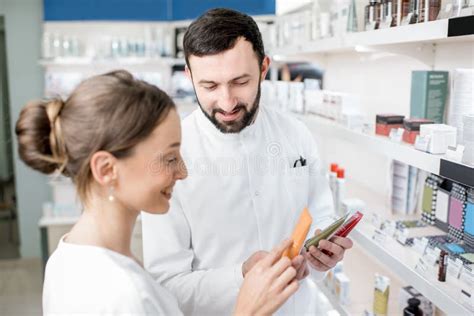 Pharmacist With Client In The Pharmacy Store Stock Photo Image Of