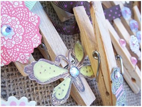 Several Wooden Clothes Pins With Different Designs On Them