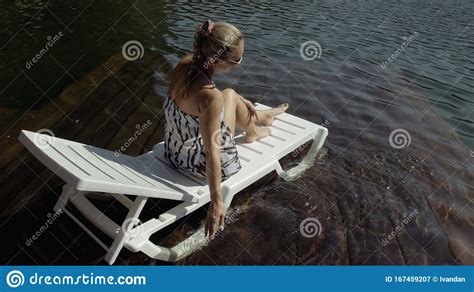 Woman Lie On A Sunbed In Sunglasses And A Boho Silk Shawl Girl Rest On