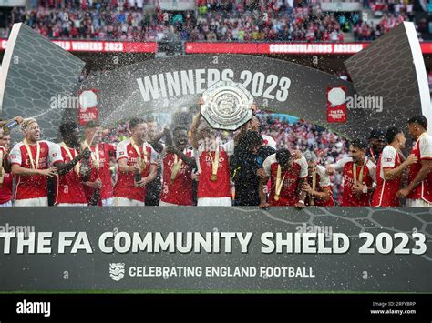 Arsenals Martin Odegaard Centre And Team Mates Lift The Trophy After