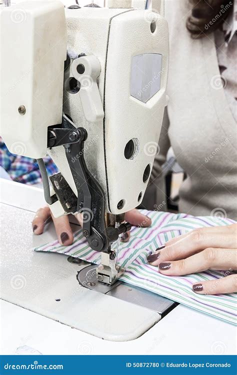 Industrial Sewing Machines With Sewing Machine Operator Stock Photo