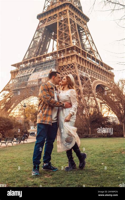 A Couple Kissing In Front Of The Eiffel Tower In Paris Romantic Trip Honeymoon In Europe