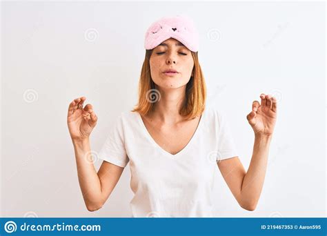 Beautiful Redhead Woman Wearing Sleeping Mask Over Isolated Background