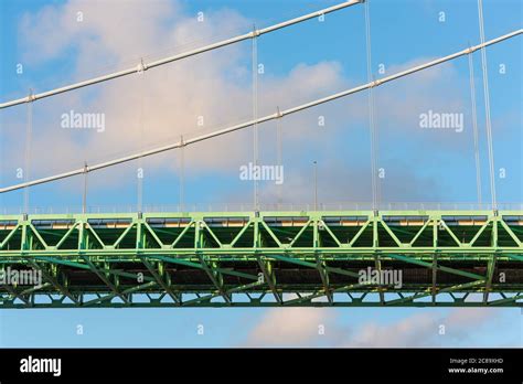 Details of a green suspension bridge Stock Photo - Alamy