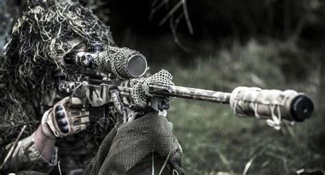 UK Army sniper with 1Rifles Battalion takes aim during an excercise at ...