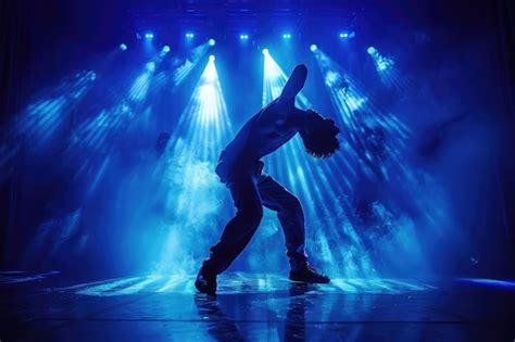 Premium Photo | Dramatic Stage Dance Performance with Blue Lighting and ...