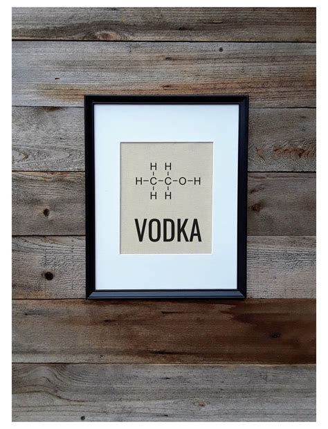 A Wooden Wall With A Framed Sign That Says Vodka