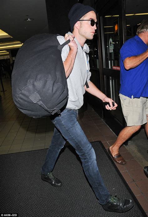 Beanie Sporting Robert Pattinson Flies Into Lax Lugging A Large Duffel