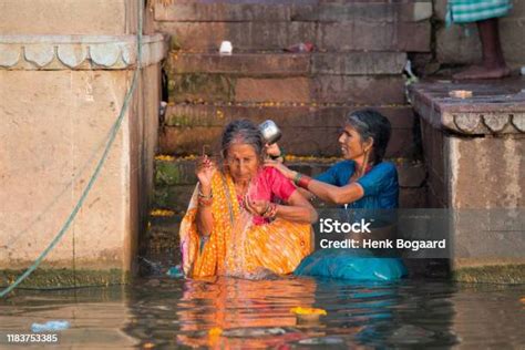 Hindu Religious Rituals In The River Ganges In Varanasi Stock Photo - Download Image Now - iStock