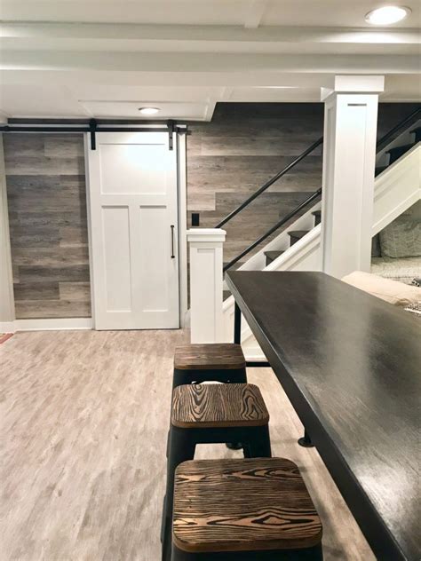 A Hgtv Fixer Upper Basement Remodel With Shiplap Wood Walls Sliding