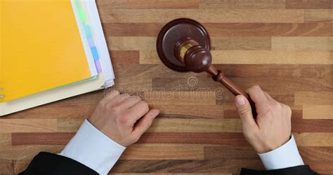 Male Judge Taps Gavel Sitting At Table In Courtroom Stock Footage