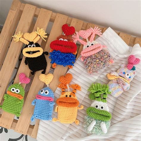 crocheted sesame street characters are displayed on a wooden tray with ...