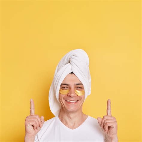 Premium Photo Satisfied Man Wearing White T Shirt And Towel Having