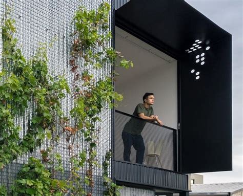 Modern Concrete Block House With Wooden Patio Attached