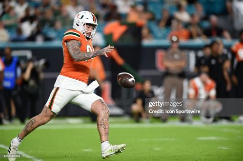 Miami Hurricanes punter Lou Hedley sets up for a punt during the ...