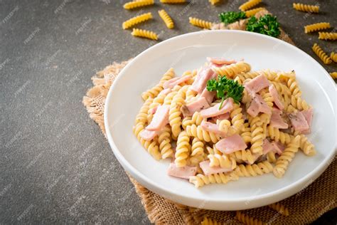 Premium Photo Spiral Pasta Mushroom Cream Sauce With Ham