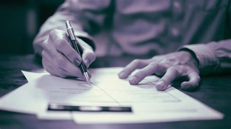 Premium Photo | Cropped view of person completing application form 