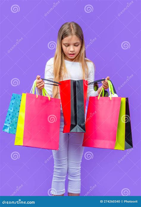 Curious Teen Girl With Shopping Purchase Isolated On Purple Teen Girl With Shopping Purchase